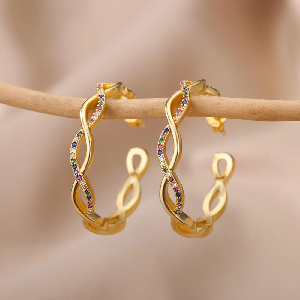 Isa wave oorbellen | 18K Goud