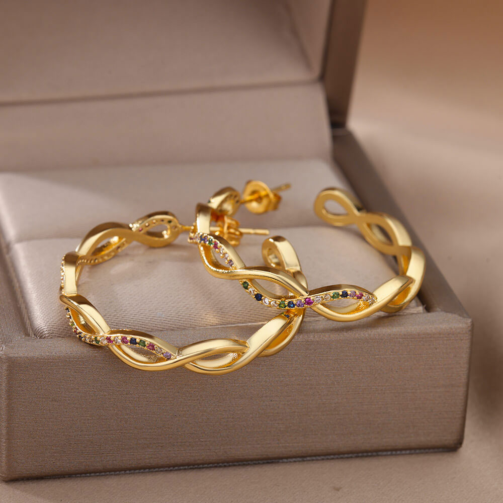 Isa wave oorbellen | 18K Goud