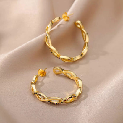 Isa wave oorbellen | 18K Goud